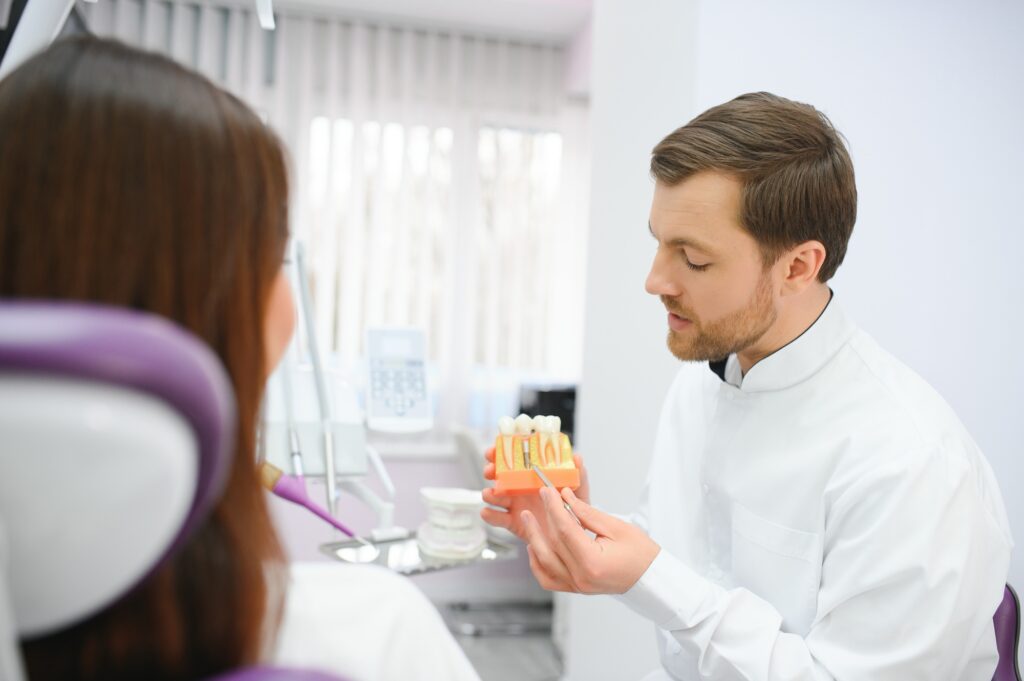 Dentist discussing dental implant options with a patient in Medford OR